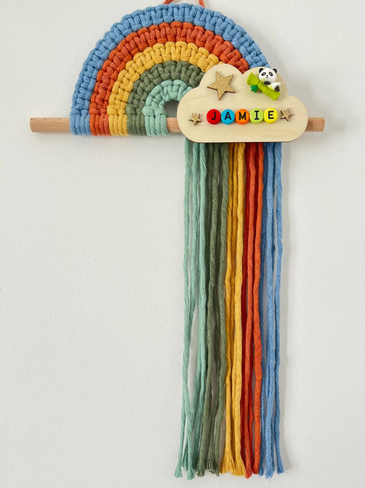 Colorful macramé rainbow on a wooden dowel with a personalised  wooden cloud plaque