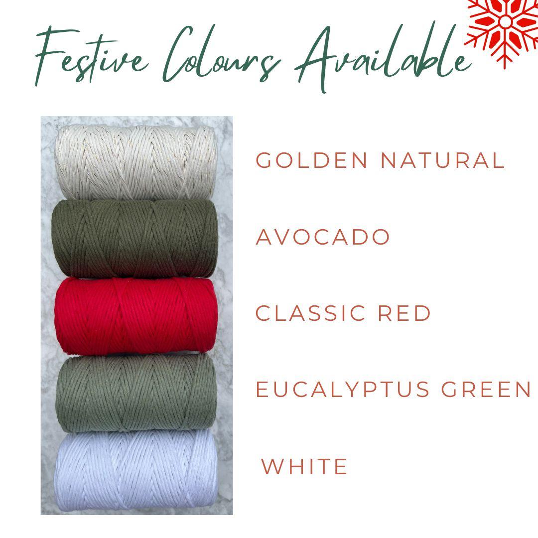 Five spools of thread in different colors with text indicating festive color options.