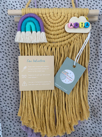 Macrame  wall hanging with colorful accents and a tag on a patterned background