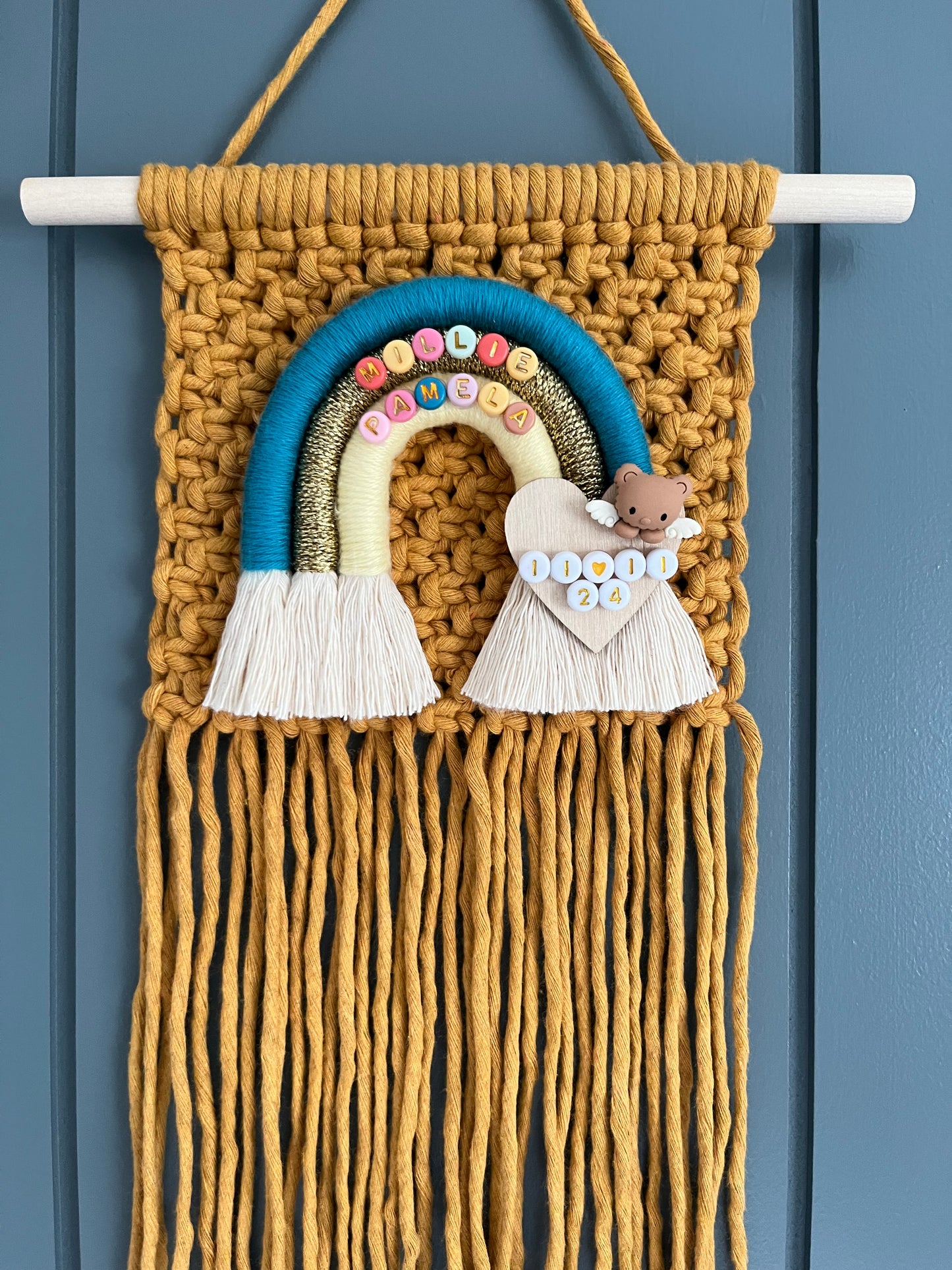 Macramé wall hanging in mustard with coordinating rainbow design , personalised and fringing